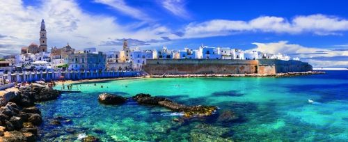 Beautiful white town Monopoli in Puglia with turquoise sea. Italy