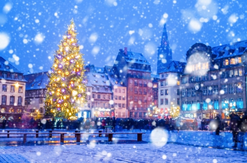 Christmas market under the snow in France, in Strasbourg, Alsace