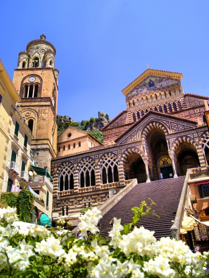 Ornate Amalfi Cathedral with flowers, Italy