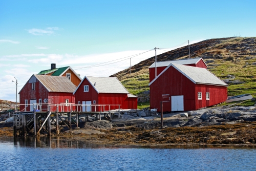 Traditional Norwegian coastal village with red wooden houses
