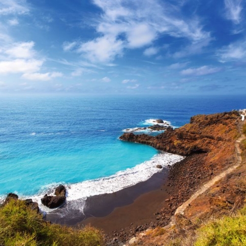 Beach el Bollullo black brown sand and aqua water