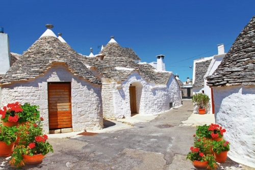 Unique Trulli houses with conical roofs in Alberobello, Italy, P