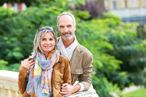 Senior couple standing on bridge~1